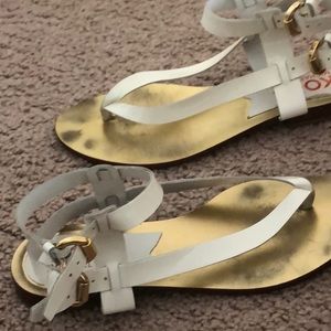 White patent gladiator sandal with gold buckle